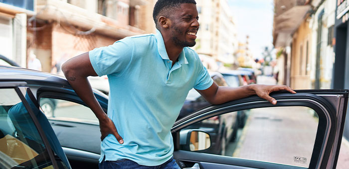 patient with hip pain needing auto accident chiropractor in McKinney