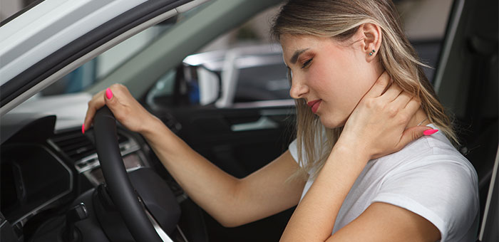 patient with neck pain needing auto accident chiropractor in McKinney