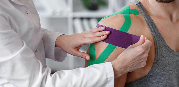 patient receiving kinesio taping in McKinney for auto accident injury recovery