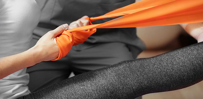 patient receiving therapeutic exercise for auto accident injury treatment in McKinney